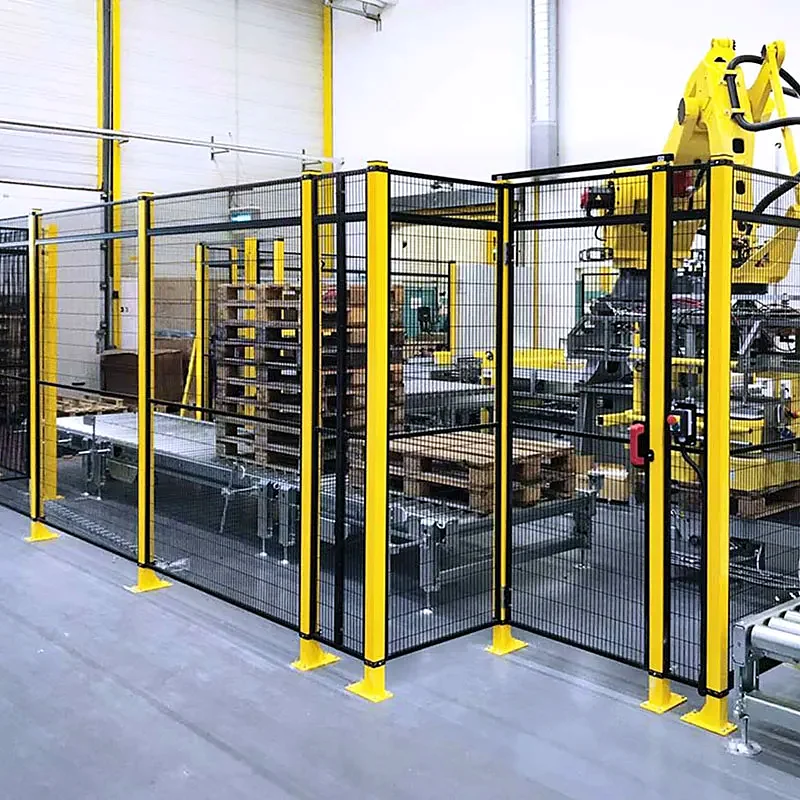 Industrial robot cell protected by yellow mesh guarding